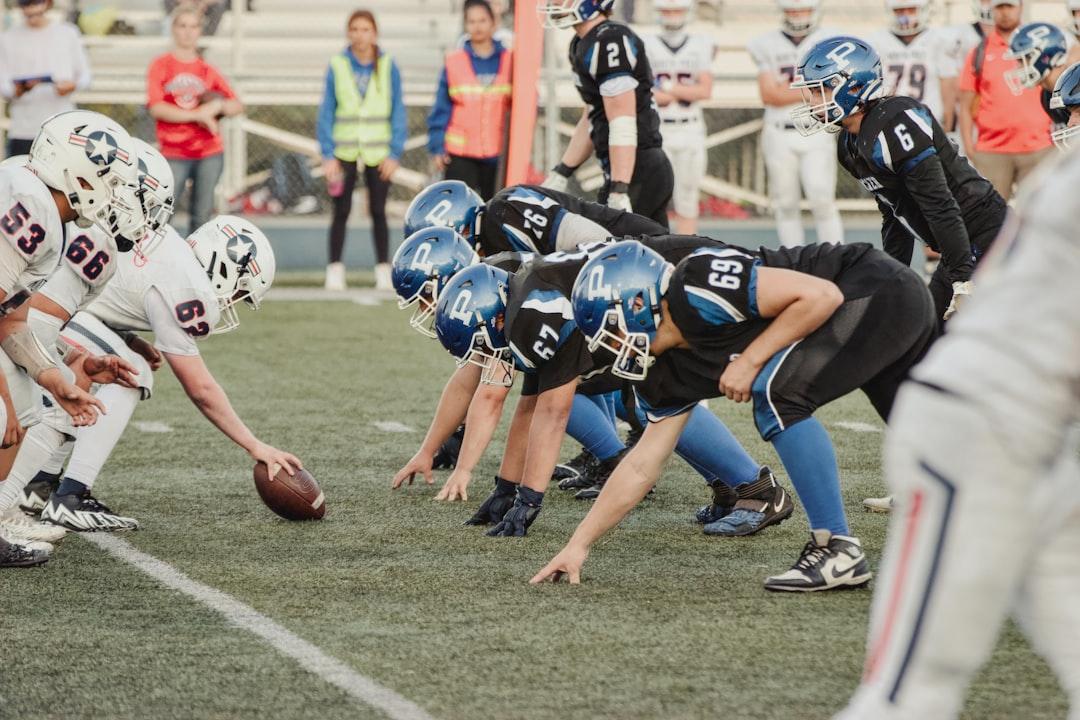 Players on a football field during a practice or spring game